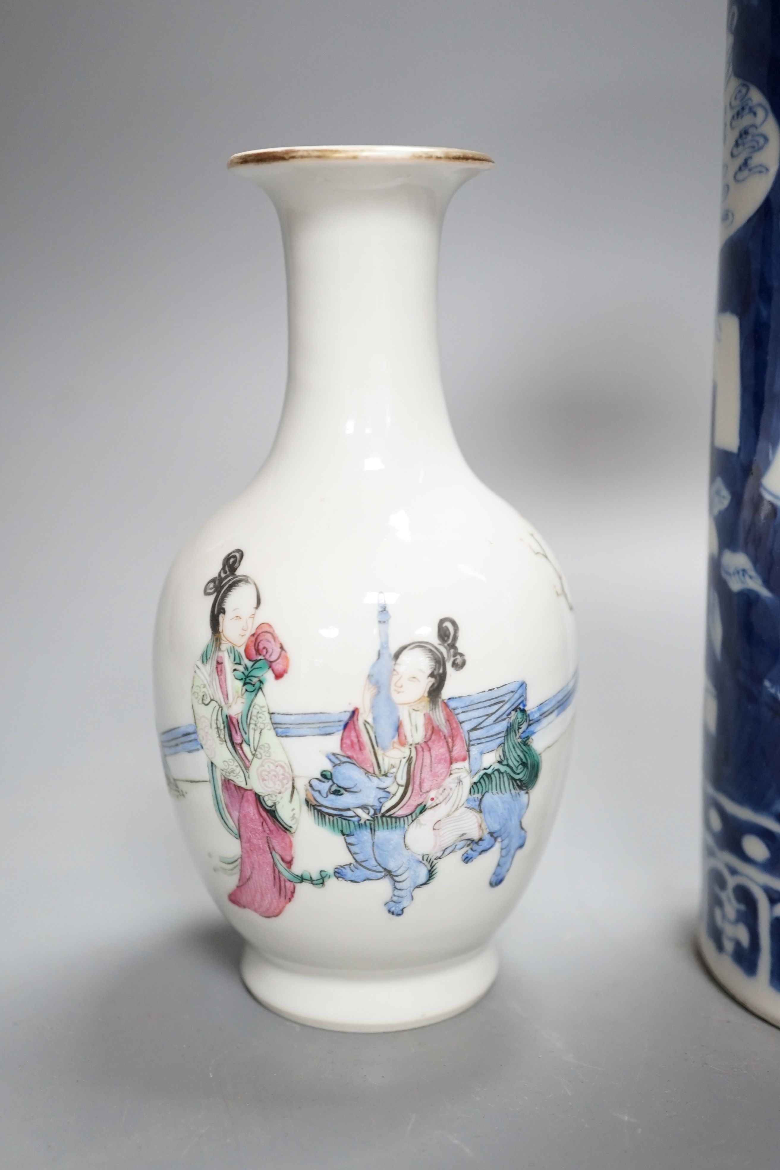 A Chinese blue and white sleeve vase and small famille rose vase, sleeve vase 25 cms high.